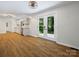 Bright kitchen featuring wood floors, stainless steel appliances, and a view to the backyard at 1123 Timberlane Dr, Lincolnton, NC 28092