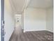 Spacious entryway featuring hardwood floors, white walls and trim, and views into other rooms at 1217 Morehead Dr, Salisbury, NC 28144