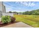 Expansive backyard view featuring well-maintained landscaping and other neighborhood homes in the distance at 13022 Rover St, Charlotte, NC 28273