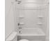 A clean, well-maintained bathtub and shower with white tile surround in a bright bathroom at 13022 Rover St, Charlotte, NC 28273
