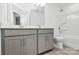 A well-lit bathroom features a double vanity, modern fixtures, and a shower-tub combination at 13022 Rover St, Charlotte, NC 28273