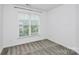 A bedroom with natural light streaming through the window offers a peaceful, private retreat at 13022 Rover St, Charlotte, NC 28273