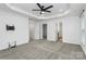 Bright bedroom with modern ceiling fan, multiple closets, and cable hookups for easy setup at 13022 Rover St, Charlotte, NC 28273