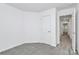 Bedroom featuring neutral walls, carpeting, a window for natural light and a view into the hallway at 13022 Rover St, Charlotte, NC 28273