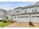 Charming home exterior with a two-car garage, landscaped yard, and a welcoming front porch at 13022 Rover St, Charlotte, NC 28273