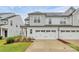 Charming two-story home with a two car garage, beautiful lawn, and classic white siding at 13022 Rover St, Charlotte, NC 28273