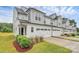 Charming two-story home with a two car garage, beautiful lawn, and classic white siding at 13022 Rover St, Charlotte, NC 28273