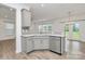 Charming kitchen with gray cabinets, stainless steel appliances and lots of natural light at 13022 Rover St, Charlotte, NC 28273