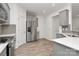 Open kitchen featuring stainless steel appliances, quartz countertops, and stylish gray cabinetry at 13022 Rover St, Charlotte, NC 28273