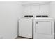 Conveniently located laundry room features a modern washer and dryer for easy laundry care at 13022 Rover St, Charlotte, NC 28273
