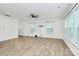 Bright living room features neutral walls, wood floors, ceiling fan and abundant natural light at 13022 Rover St, Charlotte, NC 28273