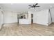 Open concept living space with kitchen, dining, and living room areas at 13022 Rover St, Charlotte, NC 28273