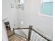 View of wooden staircase with white rails, fresh paint, and lots of light at 13022 Rover St, Charlotte, NC 28273