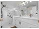 Bright bathroom featuring a double vanity, a shower with glass doors, and modern fixtures at 131 Canopy Ct, Mooresville, NC 28115