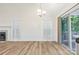 Bright dining area features wood floors, wainscoting, and sliding glass doors to the deck at 131 Canopy Ct, Mooresville, NC 28115