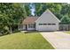 Well-maintained single-Gathering home with two-car garage, lush lawn, and mature trees at 131 Canopy Ct, Mooresville, NC 28115