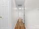 Bright hallway features wood floors and white doors at 131 Canopy Ct, Mooresville, NC 28115
