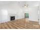 Bright living room features wood floors, a fireplace, and sliding glass doors at 131 Canopy Ct, Mooresville, NC 28115