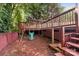 Backyard play area with swing set and multi-tiered deck offers outdoor fun at 131 Canopy Ct, Mooresville, NC 28115