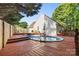 Backyard pool with wooden deck offers a tranquil oasis with stairs to additional backyard features at 131 Canopy Ct, Mooresville, NC 28115