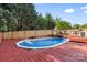Outdoor pool surrounded by a wood deck and fencing at 131 Canopy Ct, Mooresville, NC 28115
