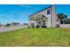 This backyard features lush green lawn and an inviting covered patio, perfect for outdoor relaxation at 1315 Elizabeth Ave, Kannapolis, NC 28083