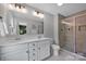 Elegant bathroom with double vanity, modern fixtures, and a tiled shower at 1315 Elizabeth Ave, Kannapolis, NC 28083