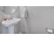 Bathroom featuring pedestal sink, chrome fixtures, and minimalist design at 1315 Elizabeth Ave, Kannapolis, NC 28083