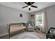 Bright Bedroom featuring a crib, chair, and natural light from a window at 1315 Elizabeth Ave, Kannapolis, NC 28083
