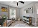 Cozy Bedroom with a crib, rocker, changing table, and ample storage at 1315 Elizabeth Ave, Kannapolis, NC 28083
