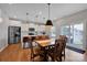 Bright kitchen with stainless steel appliances, an island with bar seating, and hardwood floors at 1315 Elizabeth Ave, Kannapolis, NC 28083