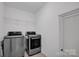 This laundry room features modern LG washer and dryer units, plus shelving for convenient storage at 1315 Elizabeth Ave, Kannapolis, NC 28083