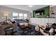 Bright living room featuring large windows, built-in shelves, and a modern entertainment area at 1315 Elizabeth Ave, Kannapolis, NC 28083