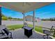 View of backyard patio area with an outdoor rug, chairs and a table for outdoor entertainment at 1315 Elizabeth Ave, Kannapolis, NC 28083