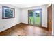 A simple bedroom featuring hardwood floors with a view of the yard at 132 Windy Hill Rd, Statesville, NC 28625