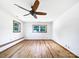 Spacious bedroom with hardwood floors, white walls, natural light, and ceiling spotlights at 132 Windy Hill Rd, Statesville, NC 28625