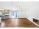 Open-concept living room connected to the kitchen with hardwood floors at 132 Windy Hill Rd, Statesville, NC 28625