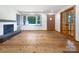 Bright living room with a stone fireplace and wooden floors at 132 Windy Hill Rd, Statesville, NC 28625
