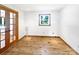 Sunlit room with hardwood floors, french doors, white walls, and natural light at 132 Windy Hill Rd, Statesville, NC 28625