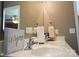 Bathroom featuring a sink with modern fixtures and a brightly lit vanity mirror at 14411 Glendon Hall Ln, Charlotte, NC 28262