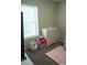 Bedroom featuring a changer, toys, and a bright window with natural light at 14411 Glendon Hall Ln, Charlotte, NC 28262