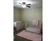 Bedroom featuring a crib, changer, neutral paint color and ceiling fan at 14411 Glendon Hall Ln, Charlotte, NC 28262