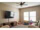 Spacious living room with plush carpet, large windows, and entertainment center at 14411 Glendon Hall Ln, Charlotte, NC 28262