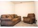 Cozy living room with brown furniture and neutral carpet flooring at 14411 Glendon Hall Ln, Charlotte, NC 28262