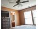 Spacious bedroom with ensuite bathroom access, ceiling fan and bright natural light at 14411 Glendon Hall Ln, Charlotte, NC 28262