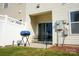 Outdoor patio area with grill, chairs, privacy fence, and easy access to yard at 14411 Glendon Hall Ln, Charlotte, NC 28262