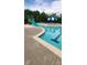 This Gathering-friendly pool offers a water slide, adjacent seating, and a large sun umbrella at 14411 Glendon Hall Ln, Charlotte, NC 28262