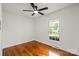 Bright bedroom with hardwood floors, white walls, and a window at 1512 Anthony Dr, Gastonia, NC 28052