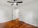 Bedroom featuring hardwood floors, a ceiling fan, and closet space at 1512 Anthony Dr, Gastonia, NC 28052