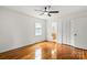 Bedroom with hardwood floors, white walls, ceiling fan, window, and closet at 1512 Anthony Dr, Gastonia, NC 28052